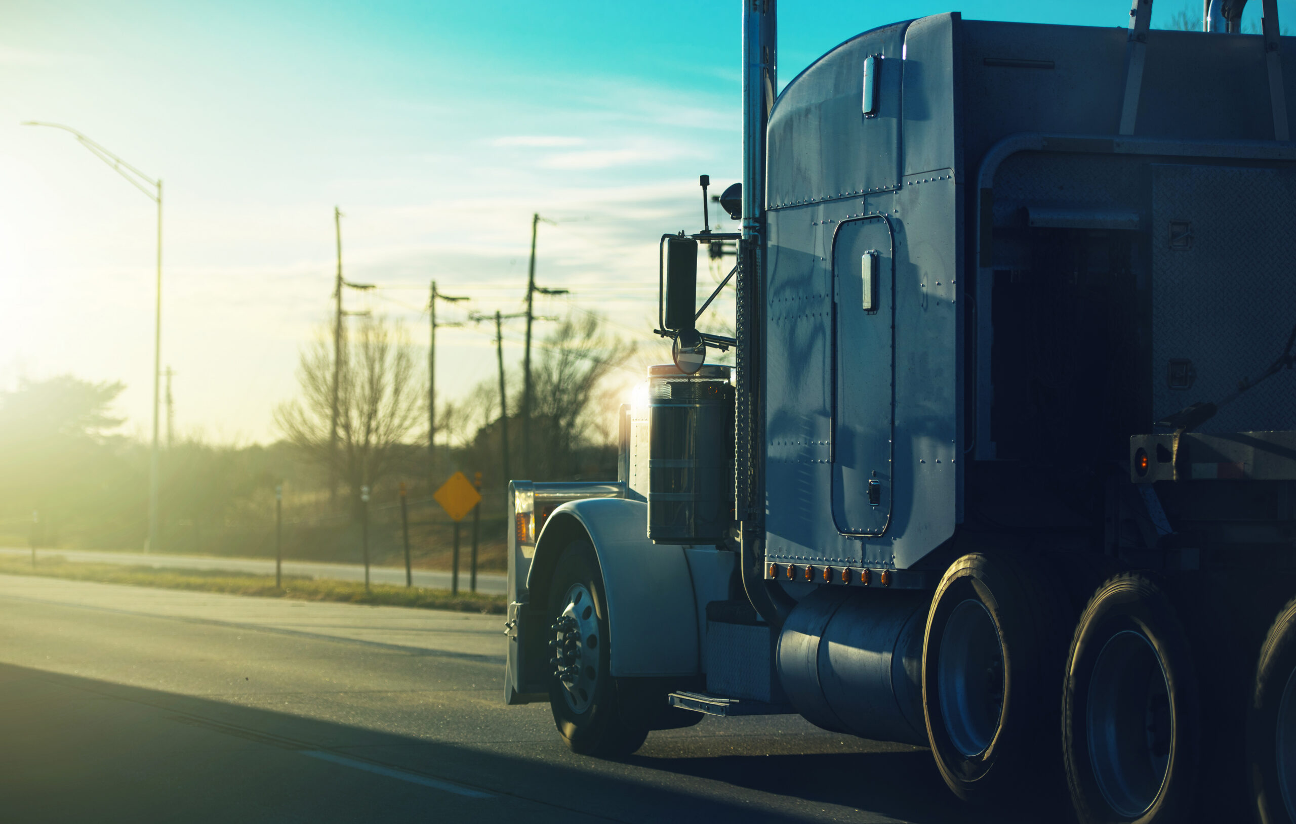 Semi Truck on an American Highway. Ground Transportation Theme.